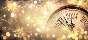 2024 New Year, shiny fairy lights, and fireworks all in gold