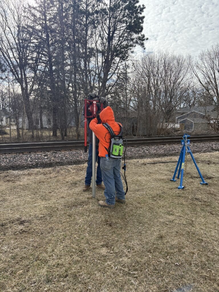 Demonstration of how to use the US Hammer electric post pounder. The NW Quik Pull is also shown in the picture off to the side.