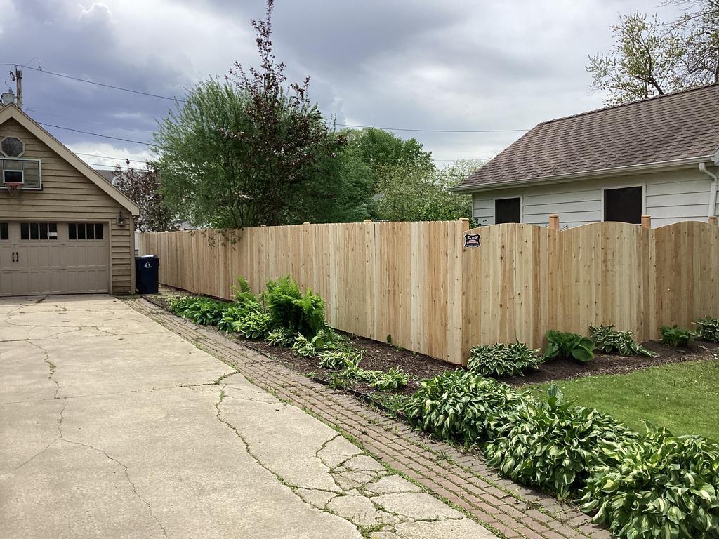 The best way to install a wood fence is with our No-Mess, No-Dig fence installation: recent cedar privacy fence picture
